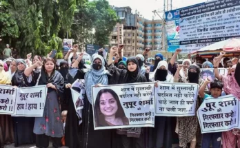 Women from the Muslim community shout slogans during their protest against BJP spokesperson Nupur Sharma over her alleged remarks on Prophet Mohammad, in Thane